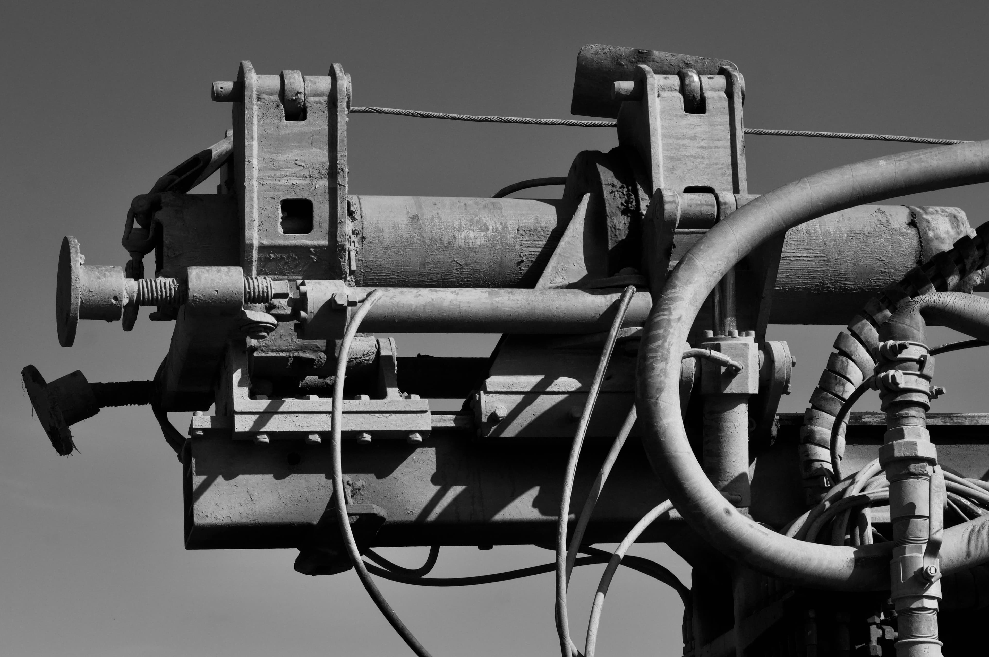 Black and white close-up of industrial machinery components